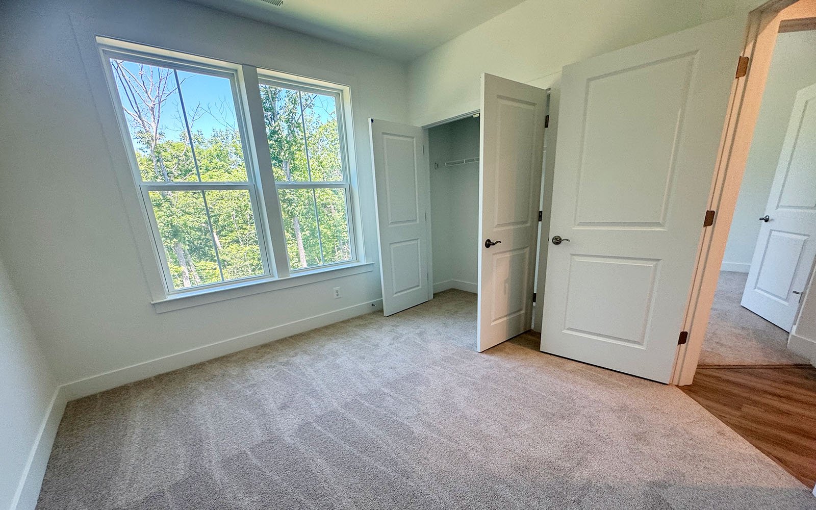 A secondary bedroom of the Scarlet on homesite 128 at Cascades at Embrey Mill.