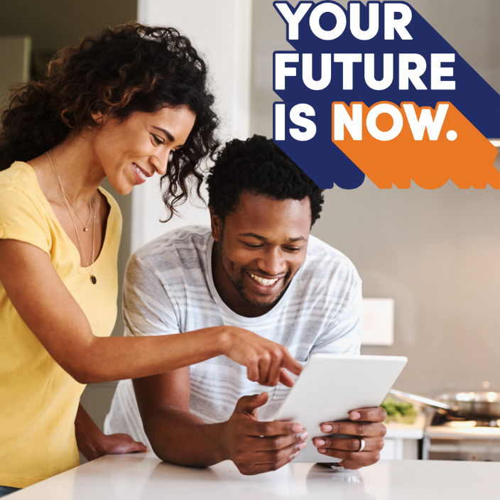 Your Future Is Now. Couple looking at tablet.
