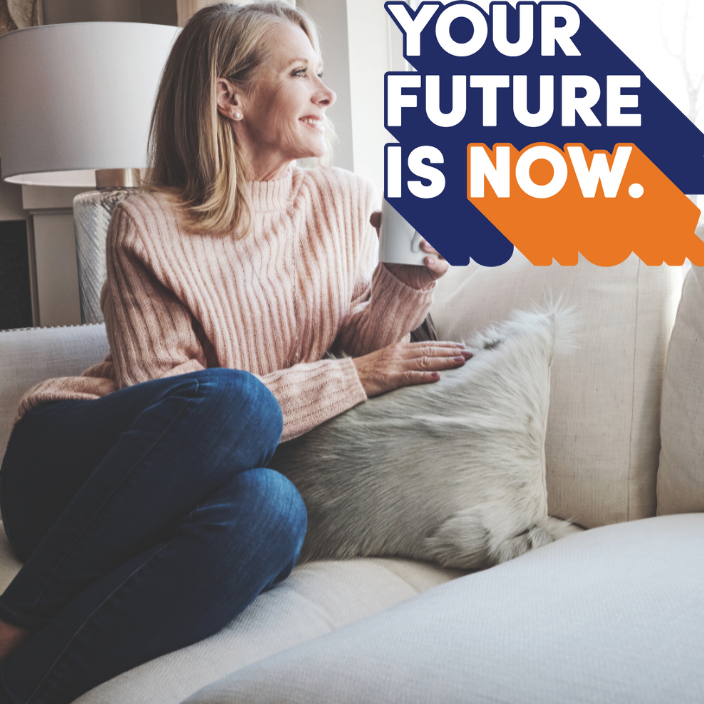 Your Future Is Now. A lady on a sofa drinking coffee.