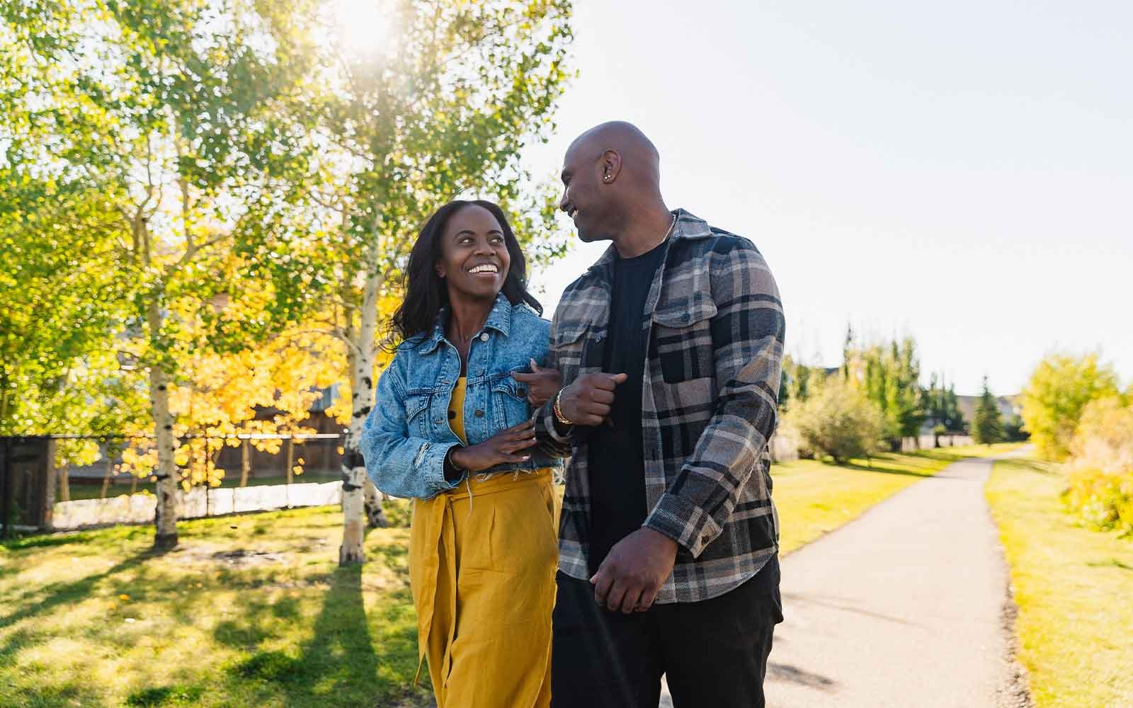 A couple enjoys a walk on a pathway in Silver Spruce