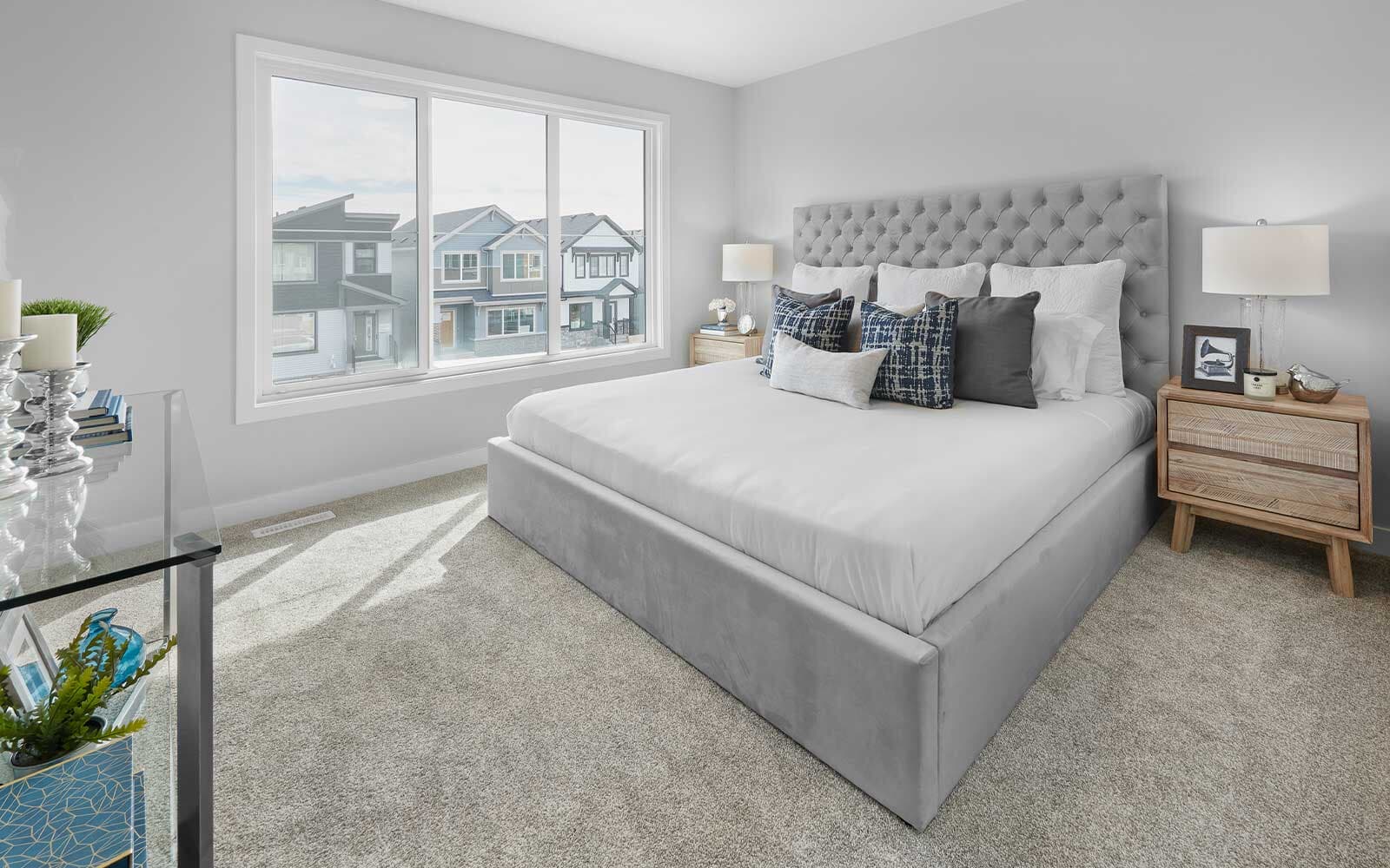 A photo of the primary bedroom of the Birch duplex model by Brookfield Residential