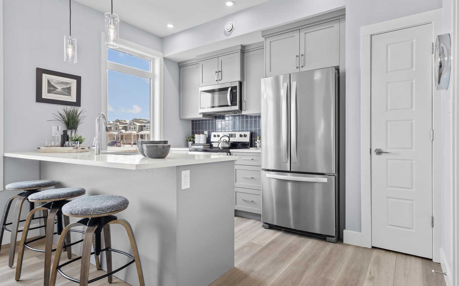 A photo of the kitchen of the Coltrane townhome model by Brookfield Residential