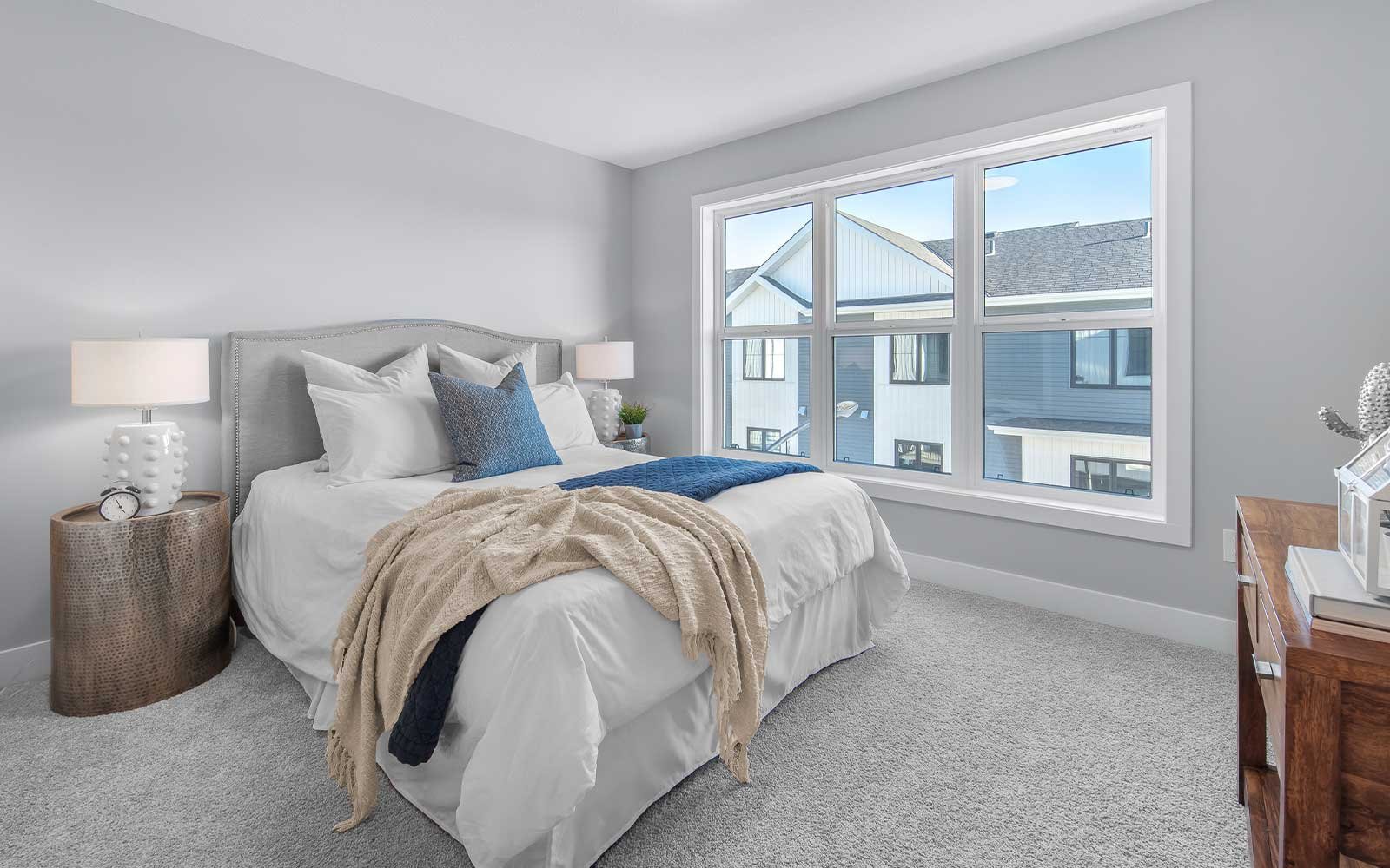 A photo of the primary bedroom in the Davis show home at The Everly in Edmonton
