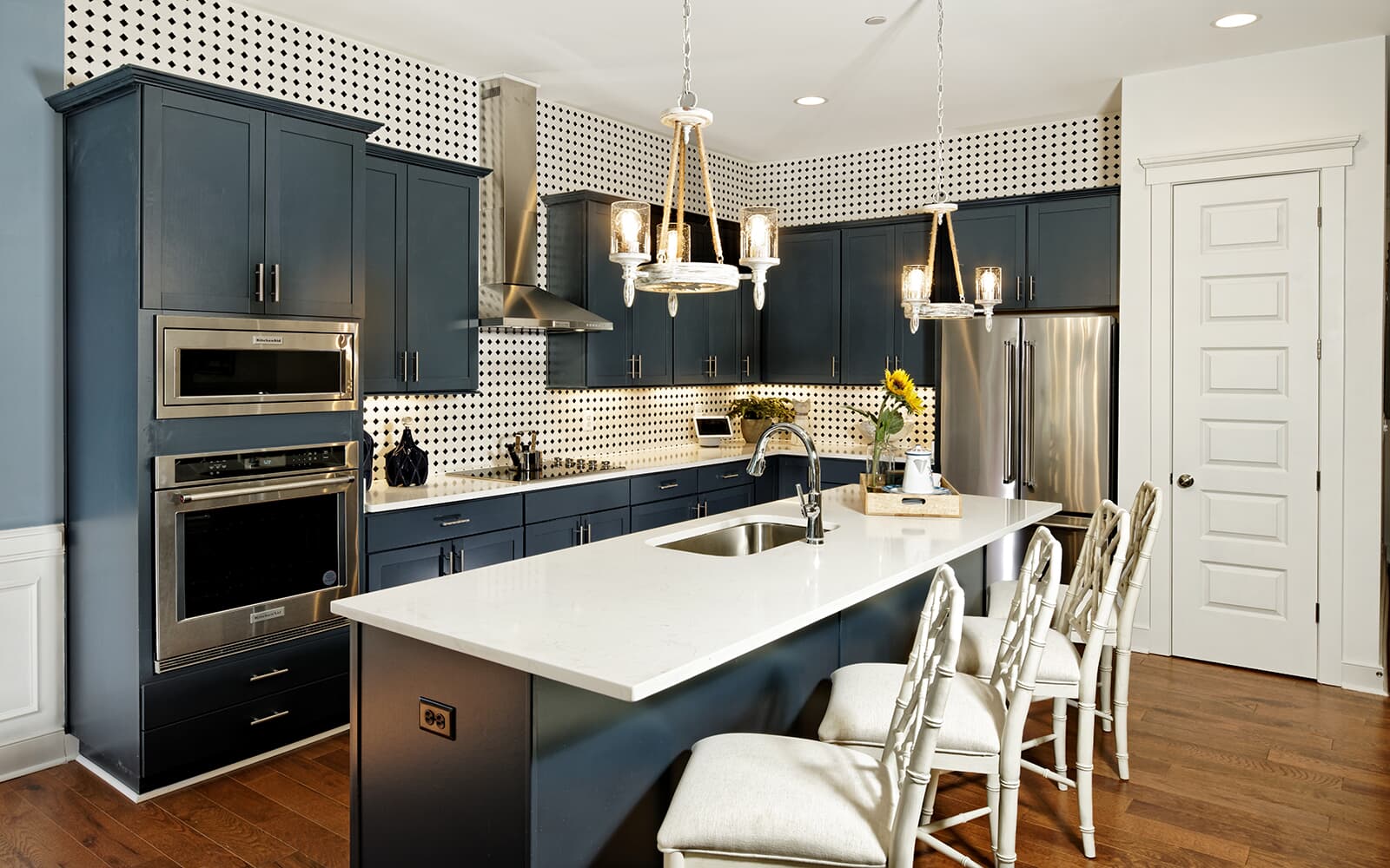 The eat-in island of kitchen in the Monet by Brookfield Residential