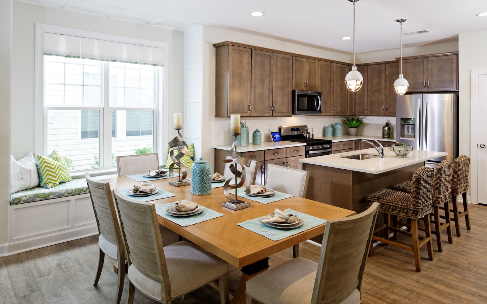 The dining room is open to the kitchen in the Picasso at Heritage Shores 