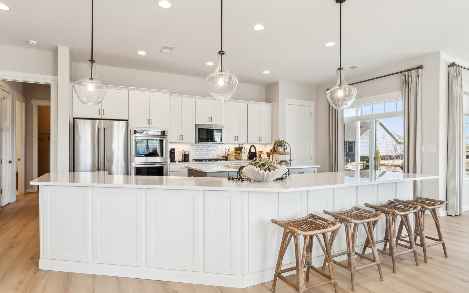 The kitchen of the Quincy II at Heritage Shores by Brookfield Residential.