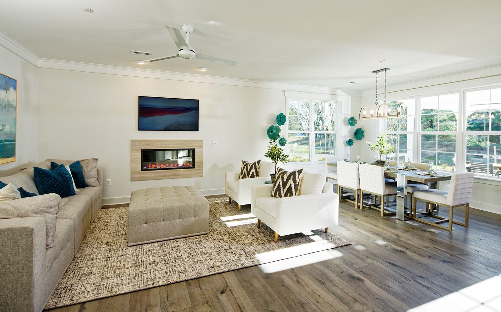 A gas fireplace in the living area within the grand room of the Beckham by Brookfield Residential