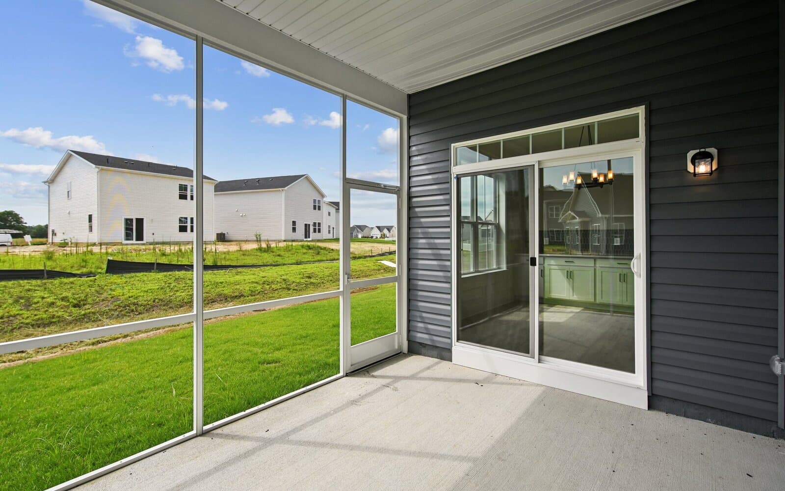 The screened porch the Rembrandt on homesite 1130 The rear exterior the Rembrandt on homesite 1130 at Lakeside at Trappe by Brookfield Residential.at Lakeside at Trappe by Brookfield Residential.