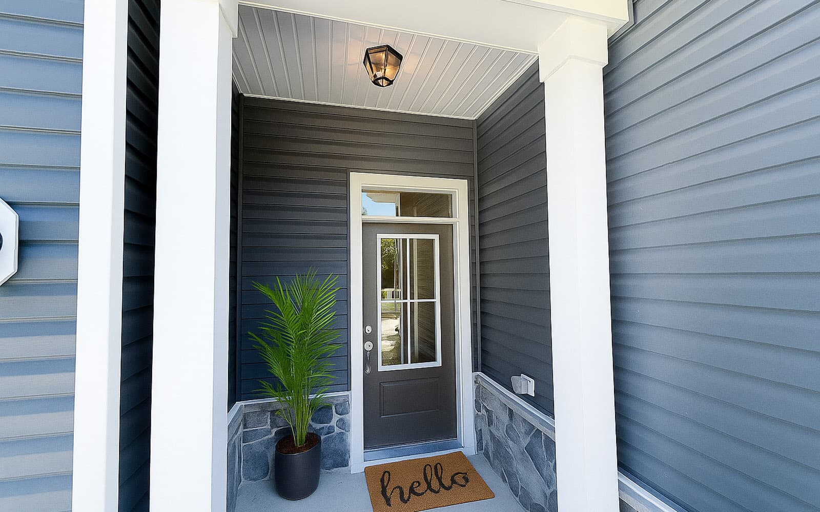 The covered entry of the Matisse on homesite 1132 at Lakeside at Trappe by Brookfield Residential.