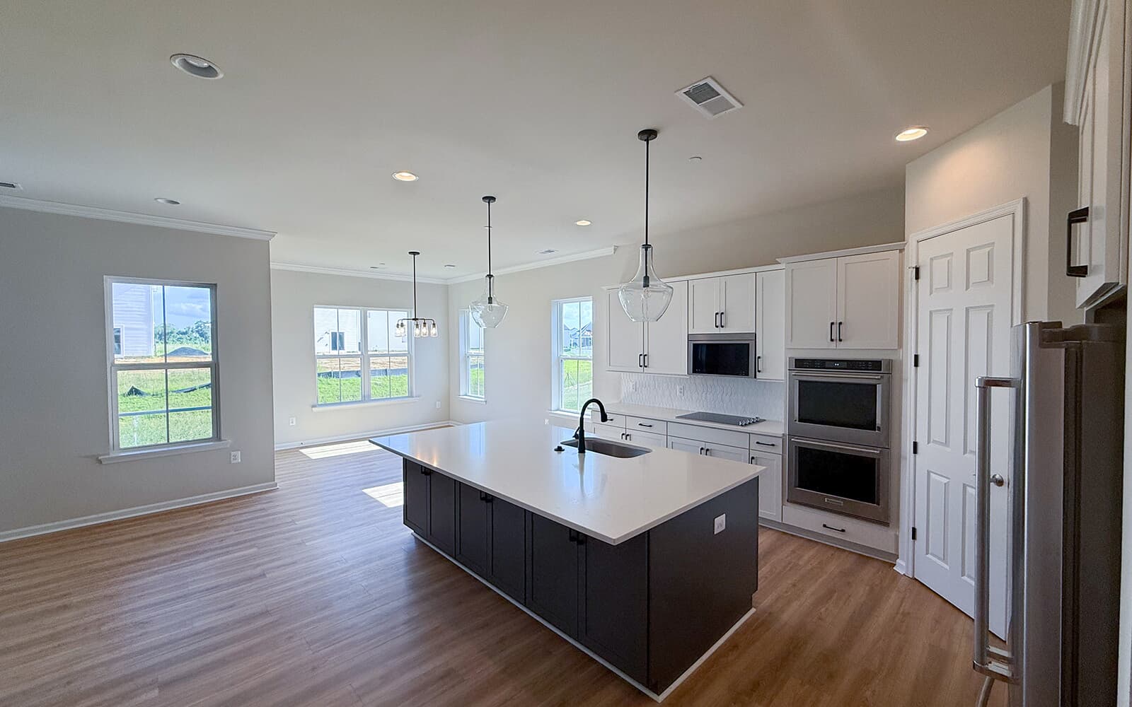 The kitchen and dining room of the Matisse on homesite 1132 at Lakeside at Trappe by Brookfield Residential.