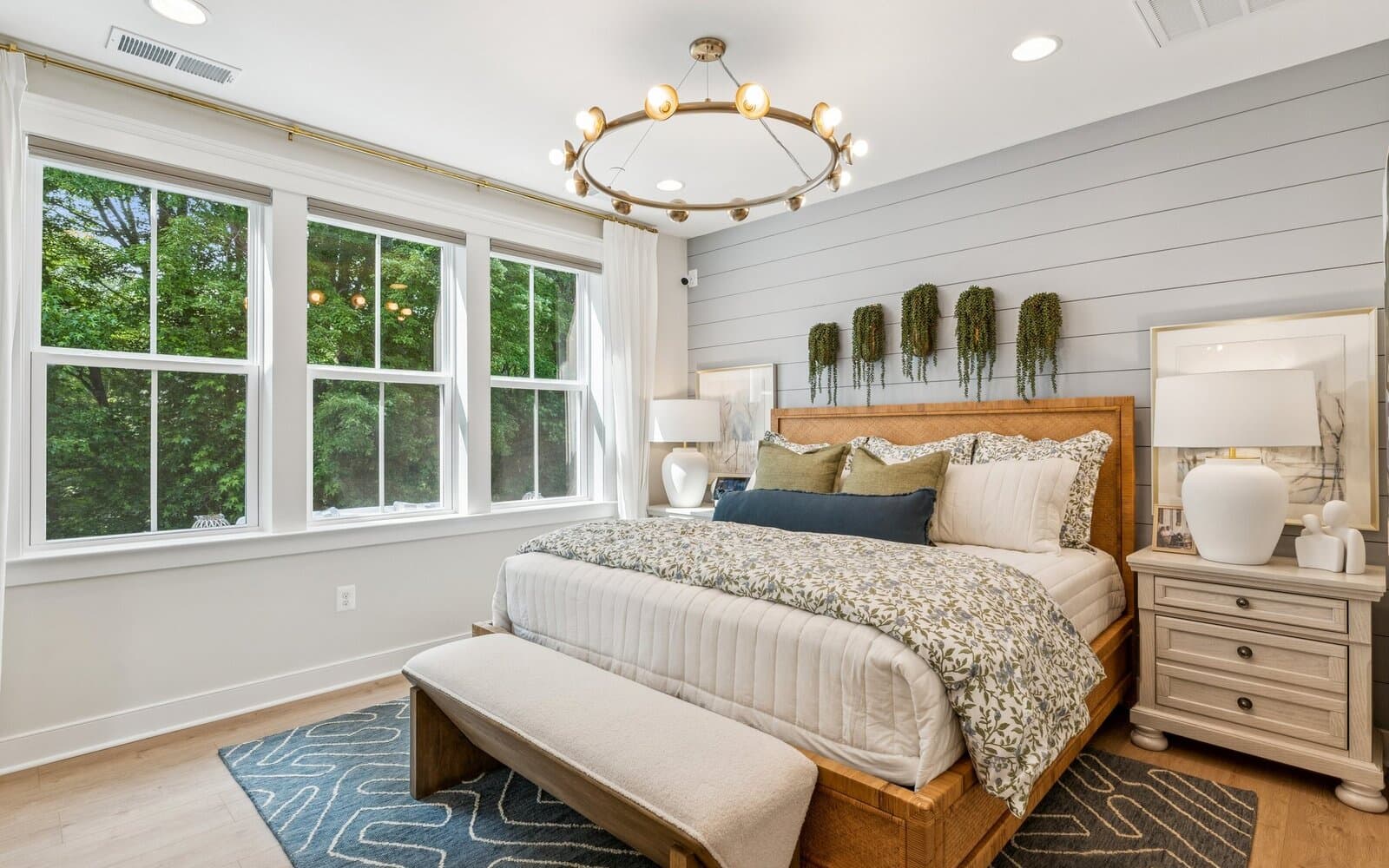 The main level primary bedroom of the Torrington at Lakeside at Trappe.