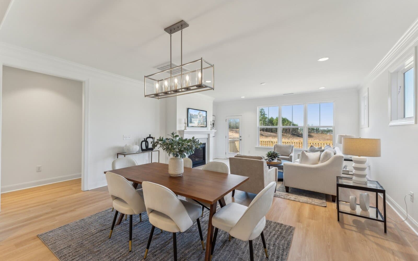 The dining area and great room of the Declan single family home by Brookfield Residential at Wendell Falls.