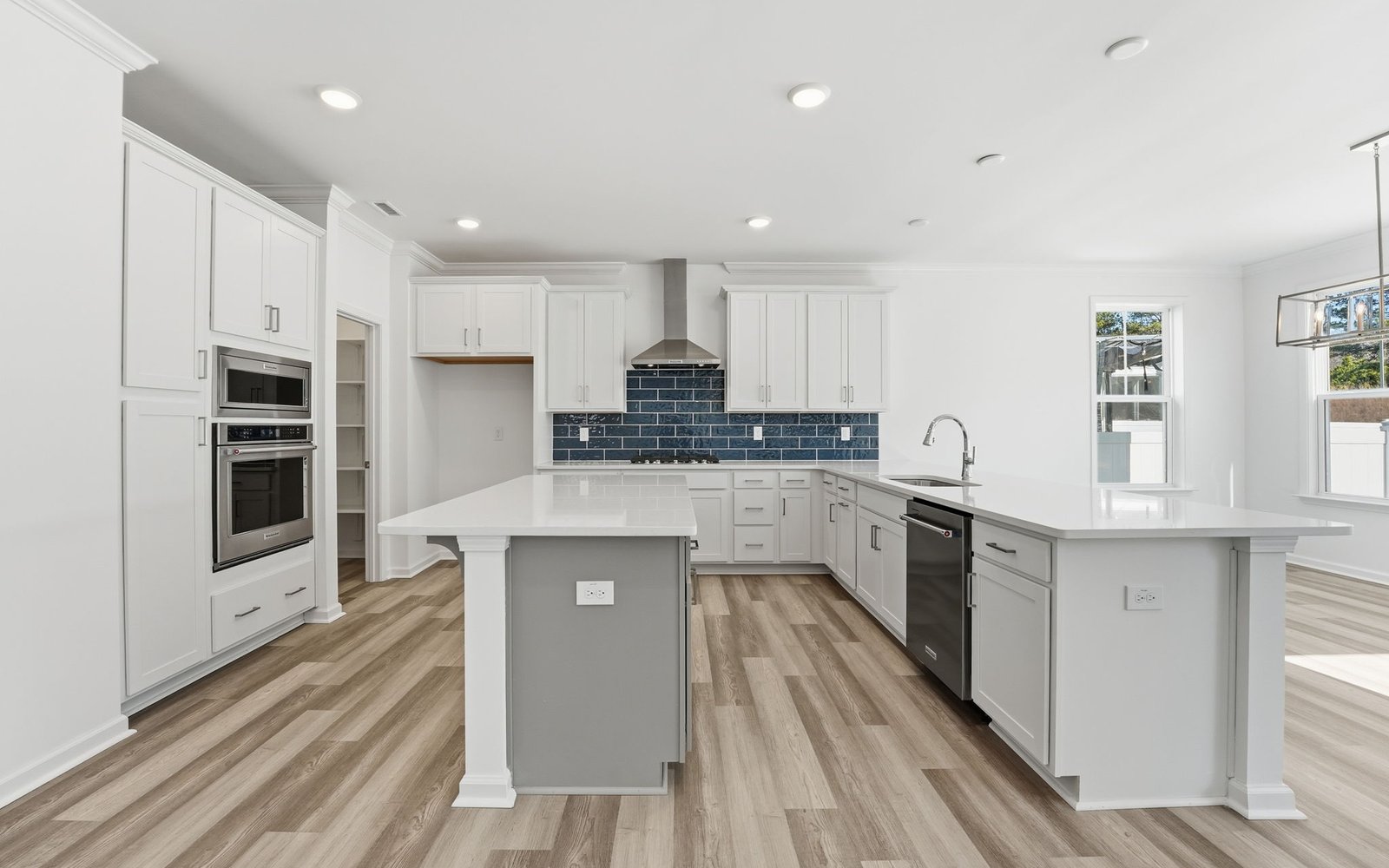 The double island kitchen of the Sterling at Wendell Falls.