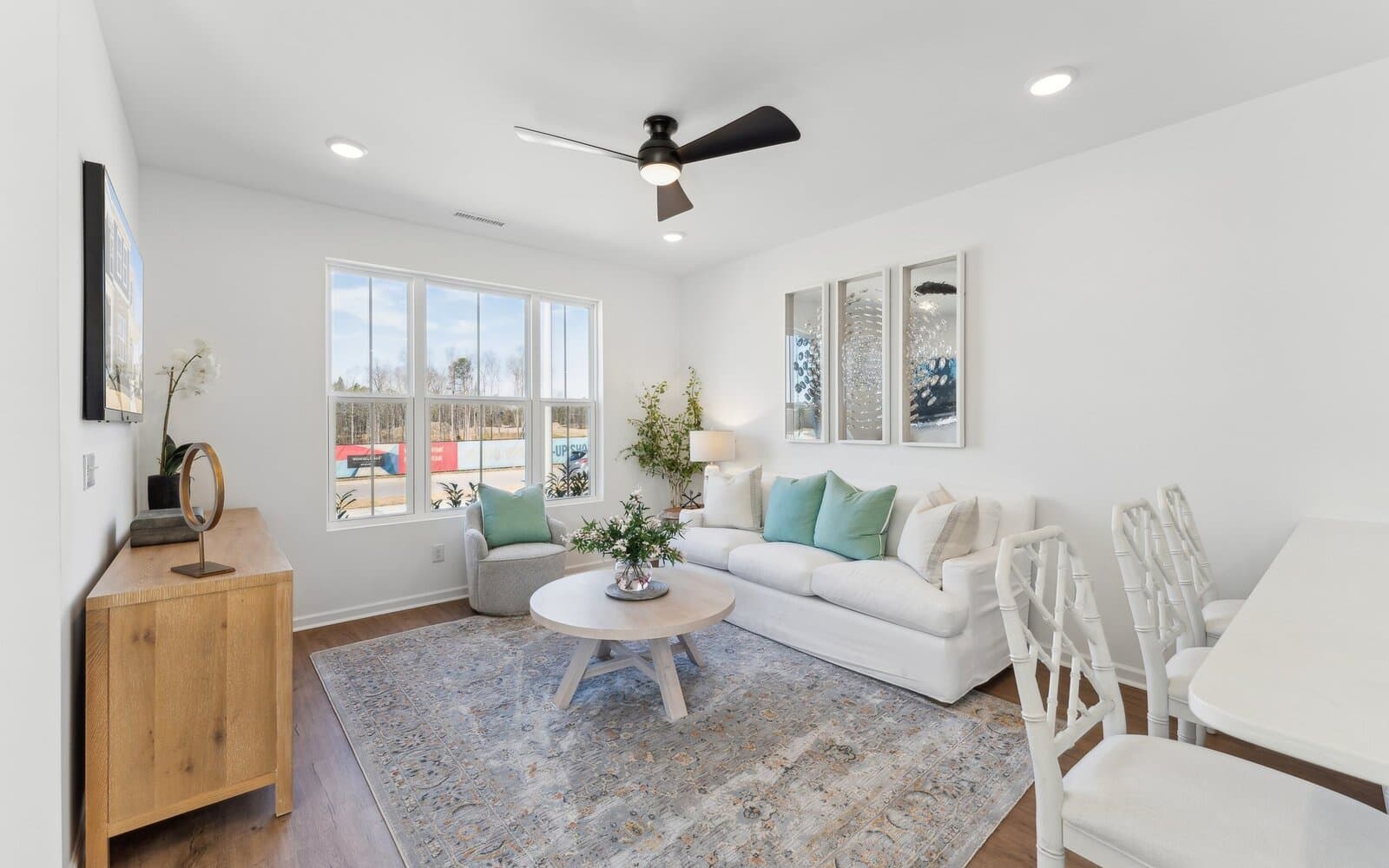 The family room of the Morgan townhome model by Brookfield Residential at Wendell Falls.