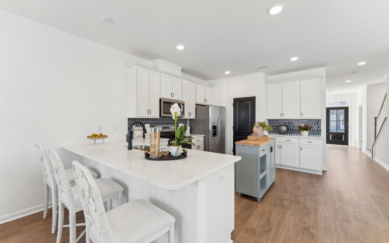 The kitchen of the Morgan townhome model by Brookfield Residential at Wendell Falls.