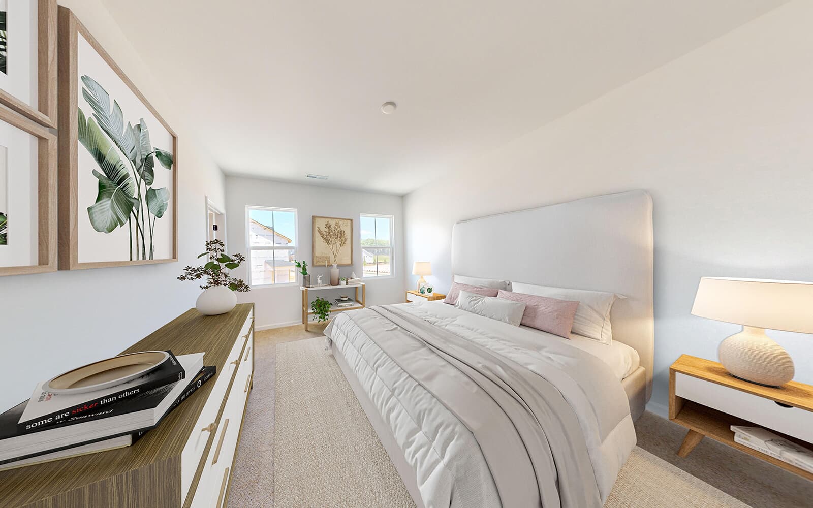 A primary bedroom in the Morgan townhome  by Brookfield Residential at Wendell Falls.