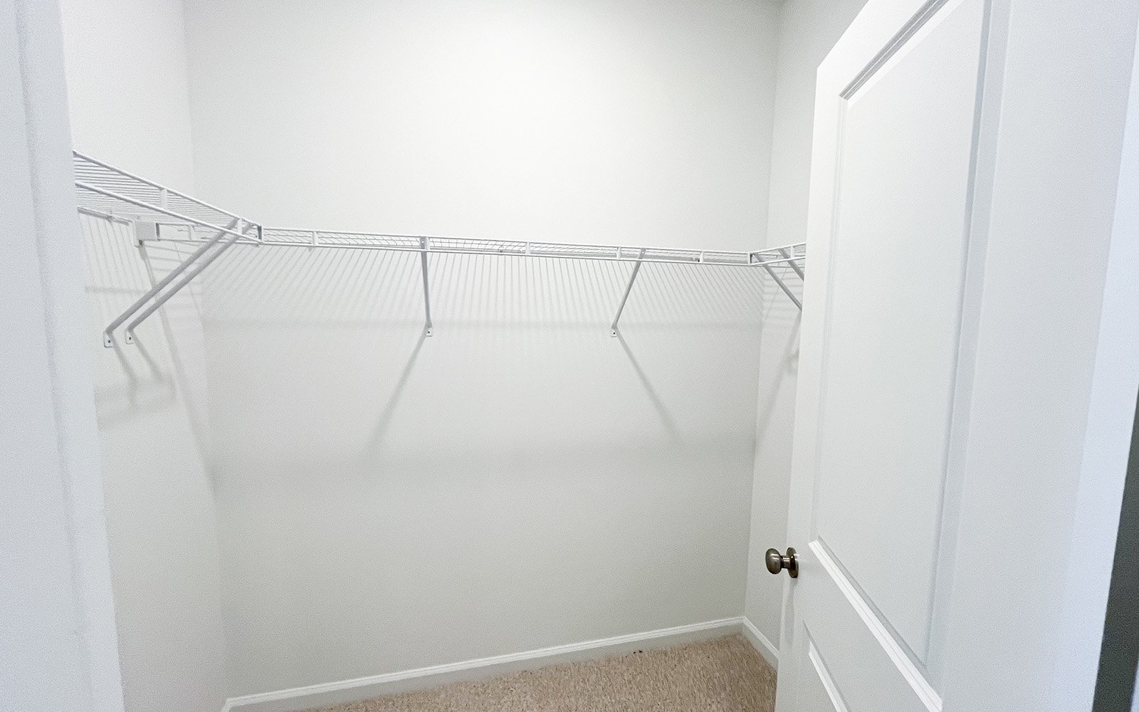 A walk-in closet in the Morgan on homesite 2548 by Brookfield Residential at Wendell Falls.