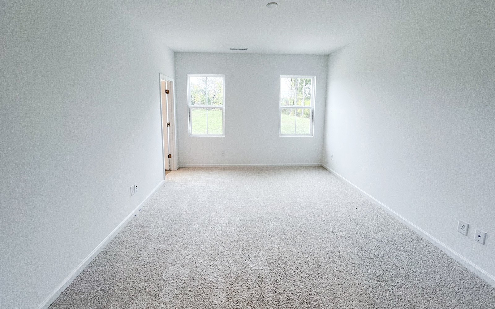 The primary bedroom in the Morgan on homesite 2548 by Brookfield Residential at Wendell Falls.