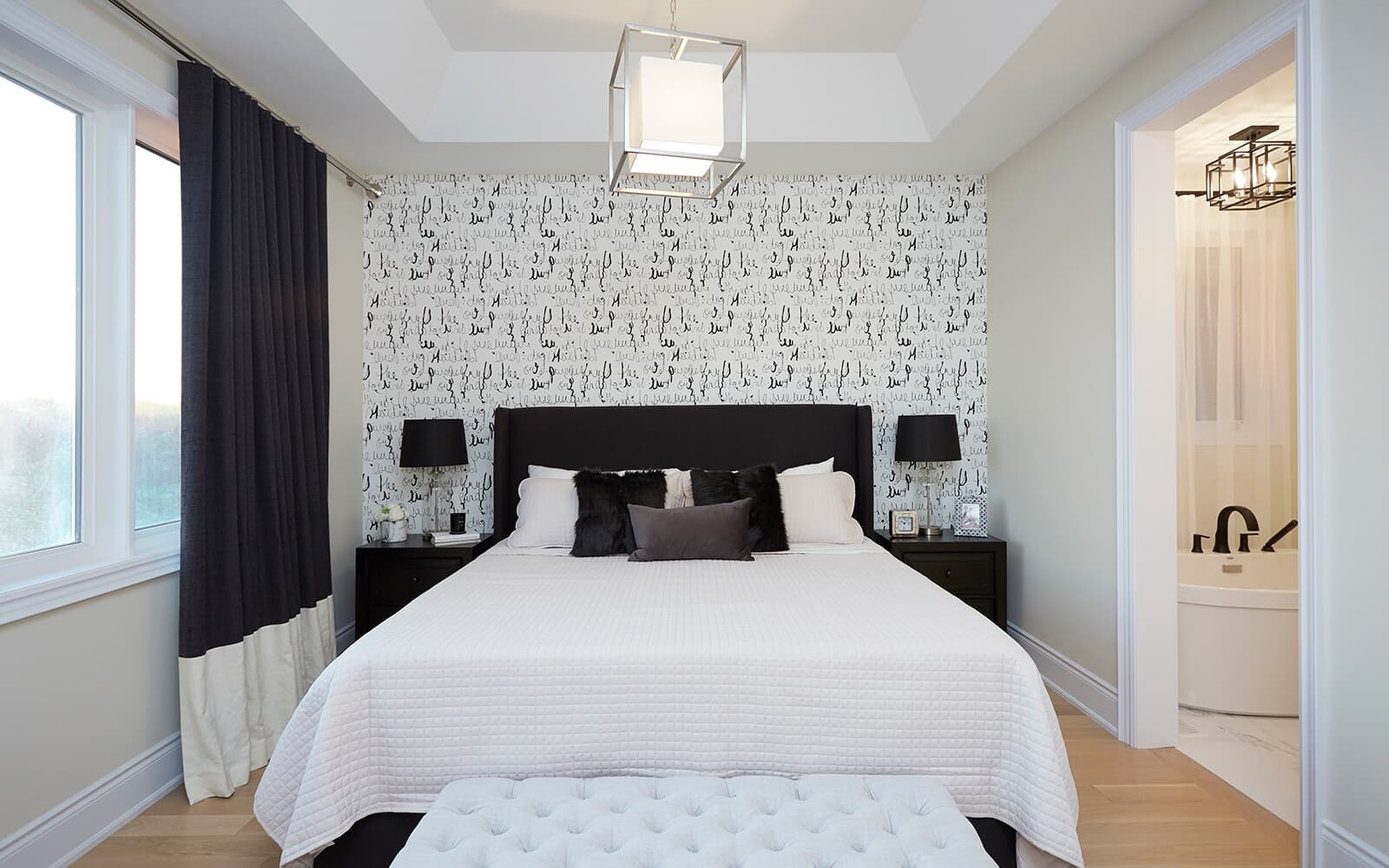 Primary Bedroom in the Braydon Model Home at Heartland in Baxter, Ontario.