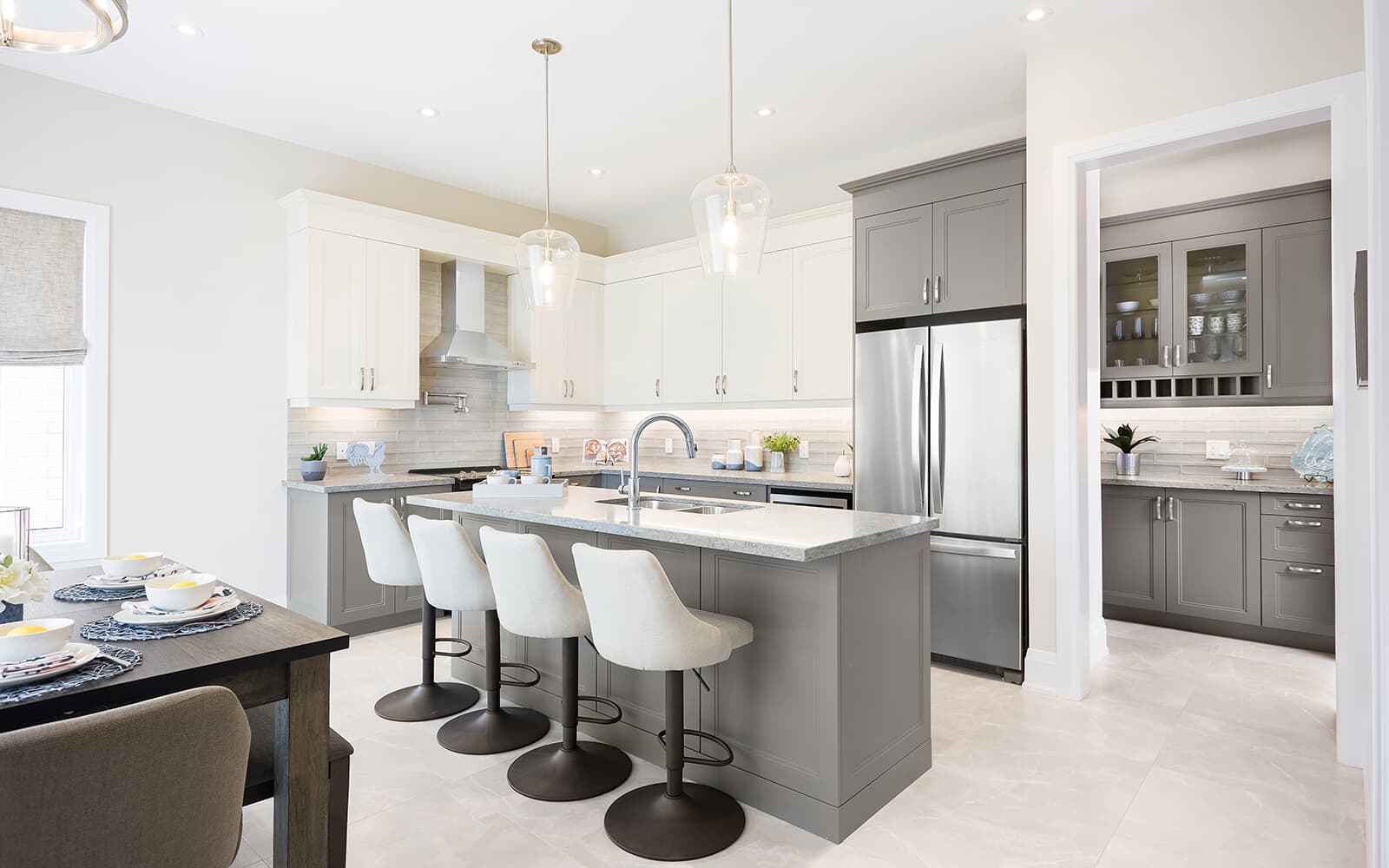 Kitchen and Servery in the Hickling Model Home at Midhurst Valley in Midhurst, Ontario.