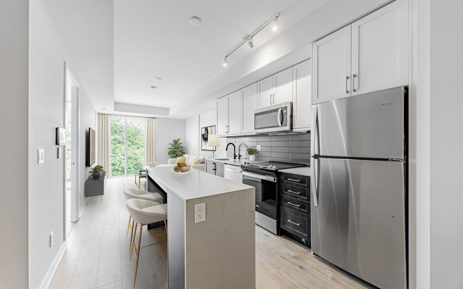 Virtually staged kitchen photo of a Walnut suite at Station No. 3 in Whitby, ON