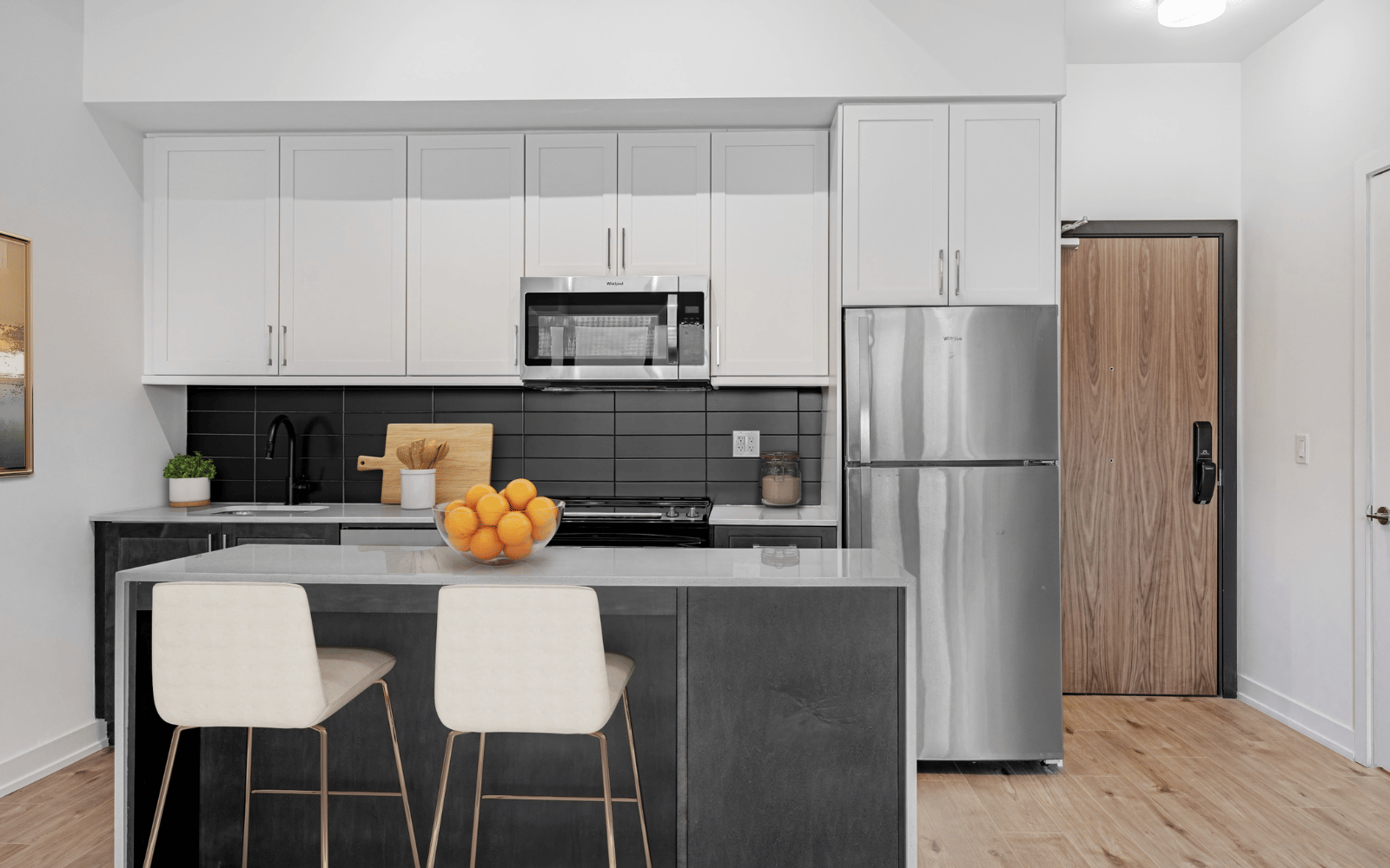 Virtually staged photo of the kitchen in Suite 101 at Station No. 3 in Whitby, ON