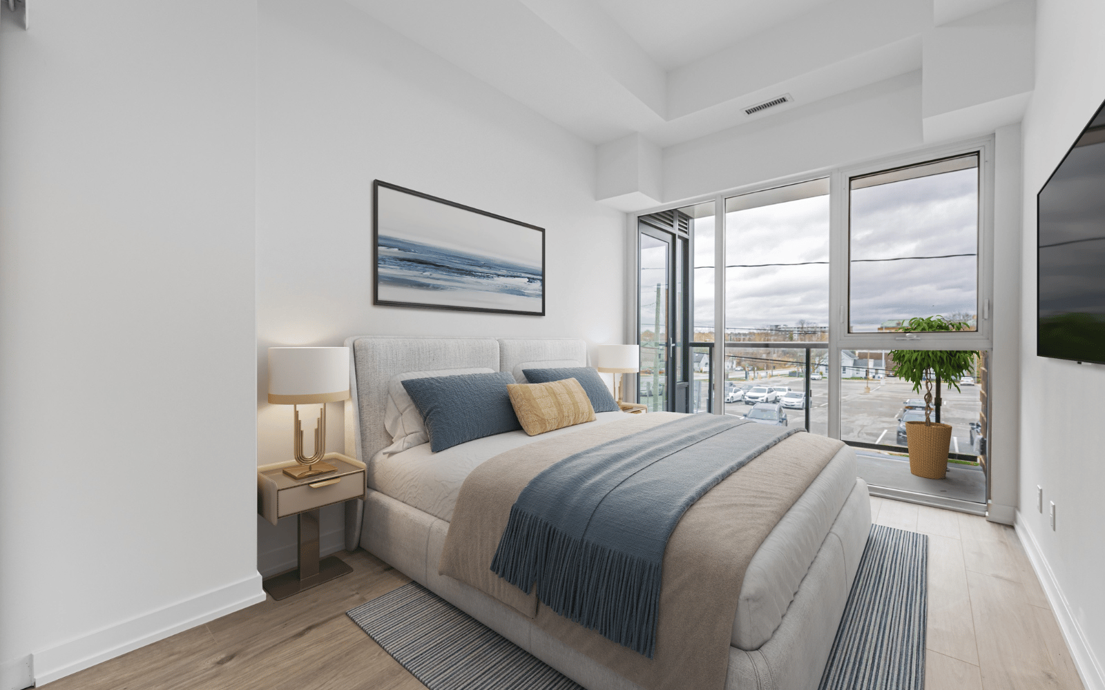 Virtually staged photo of the primary bedroom in Suite 101 at Station No. 3 in Whitby, ON