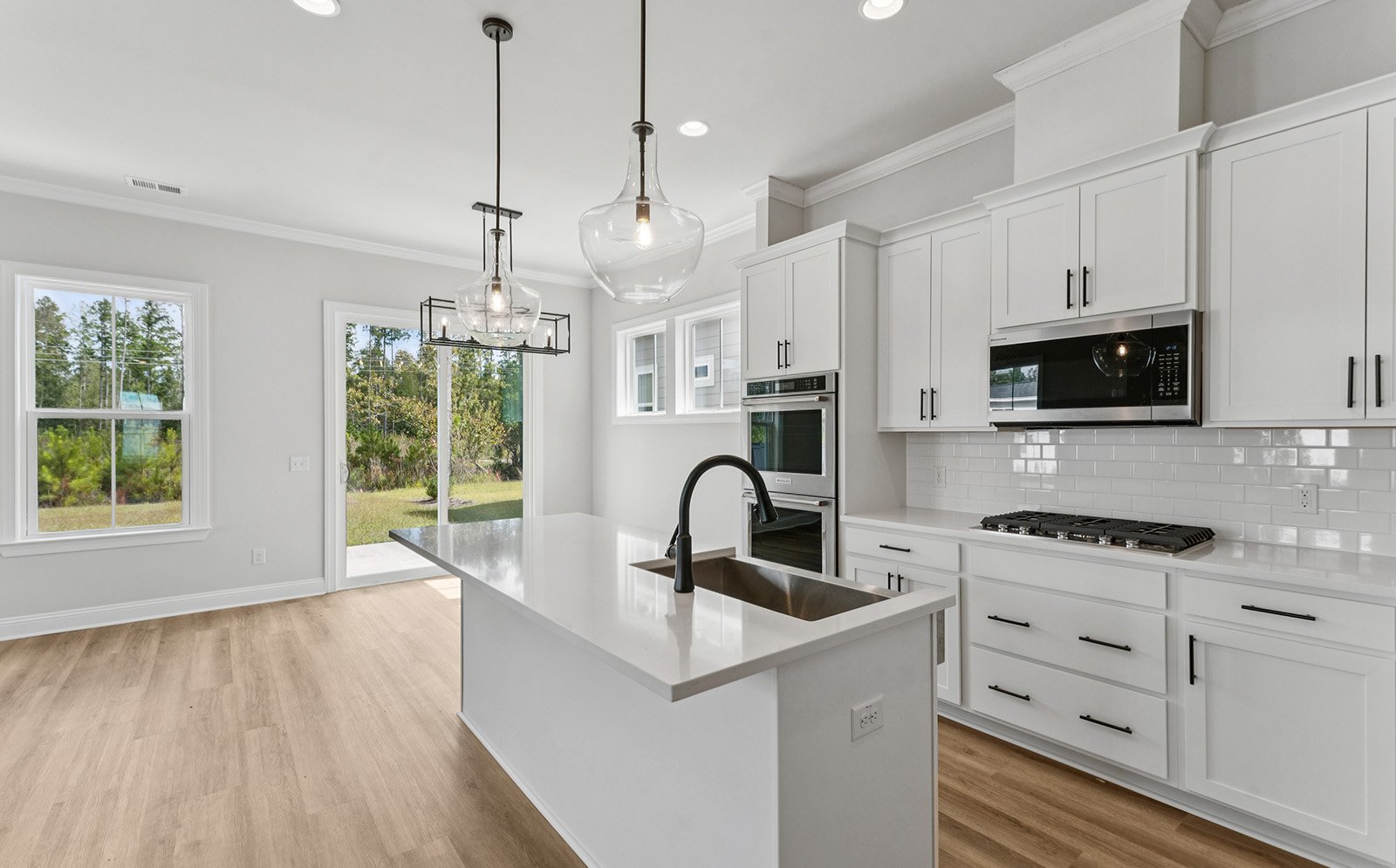 The kitchen and dining area in the Preston single family home by Brookfield Residential at Nexton.