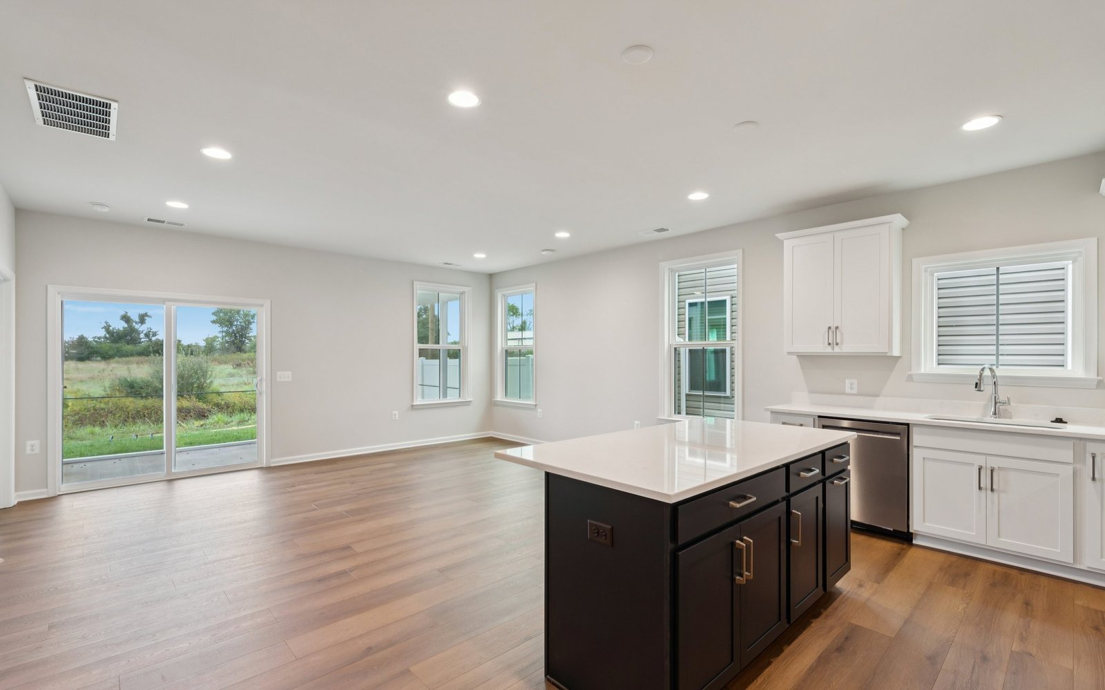 The kitchen and family room of a Fitzgerald garden home at Hiatt Pointe at Snowden Bridge.