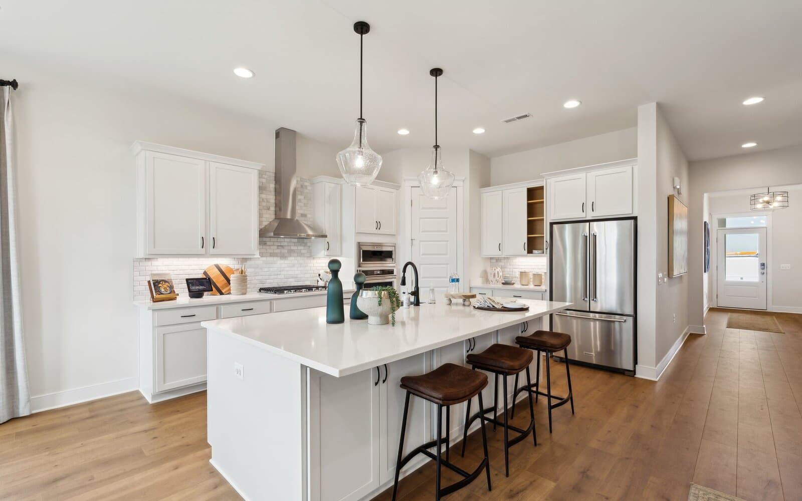 The kitchen in the Matisse model single family home at Hiatt Pointe at Snowden Bridge by Brookfield Residential.