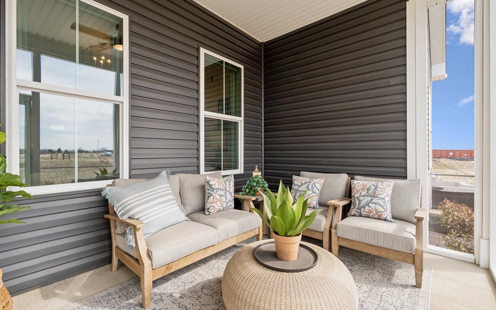 The rear screened porch of the Matisse model single family home at Hiatt Pointe at Snowden Bridge by Brookfield Residential.