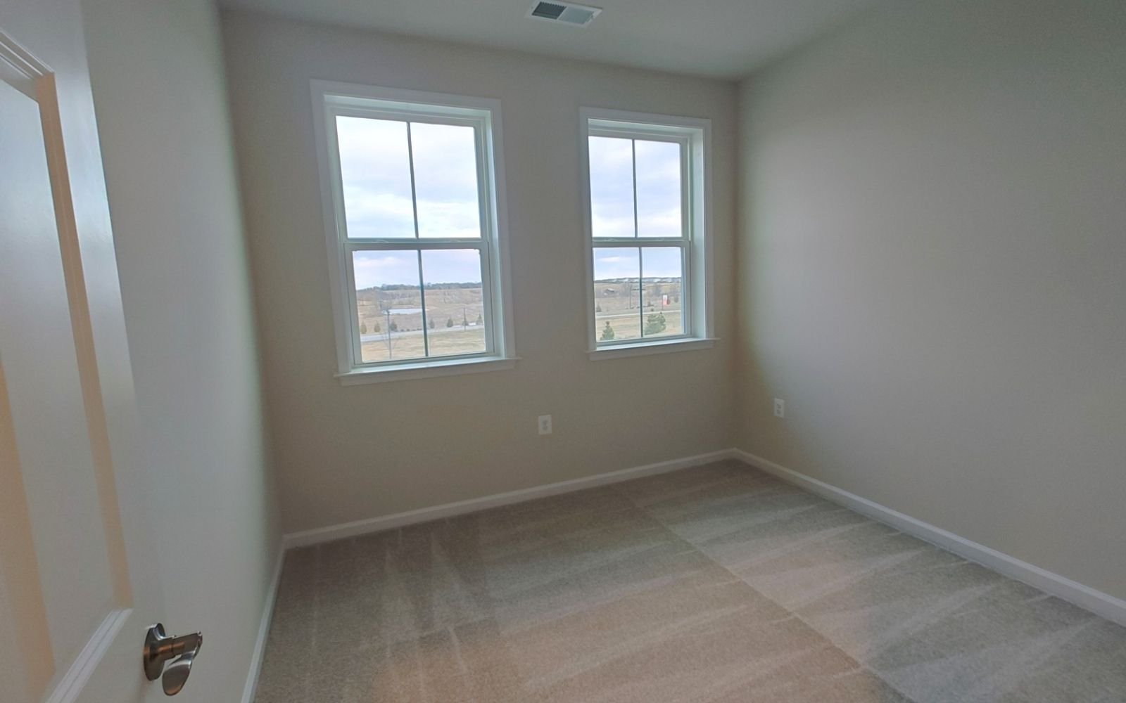 A secondary bedroom of the Northgate on homesite 1010 at Hiatt Pointe at Snowden Bridge.