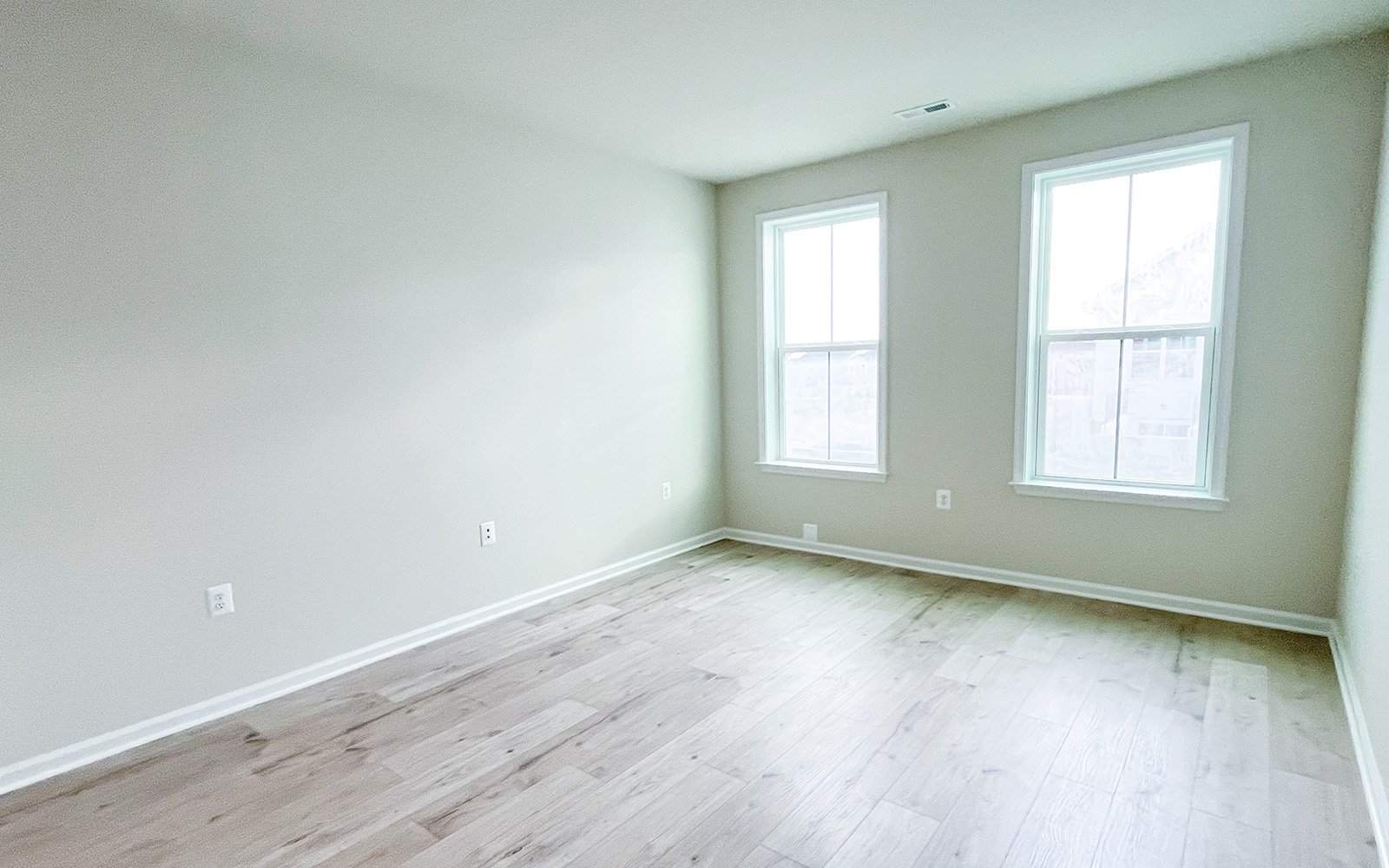 The main level primary bedroom of the Northgate on homesite 1011. 