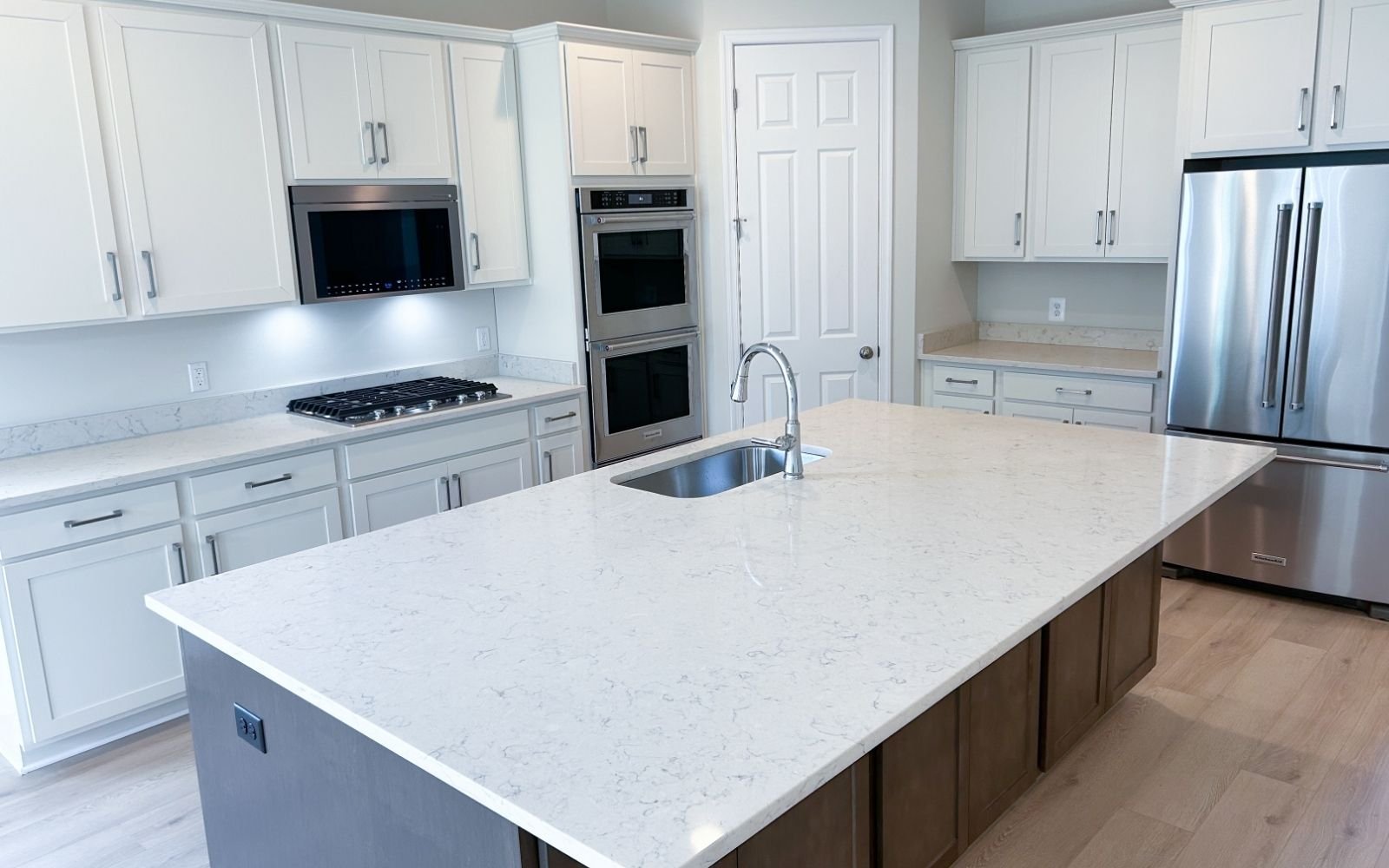 The kitchen of the Matisse on homesite 1120 at Hiatt Pointe at Snowden Bridge.
