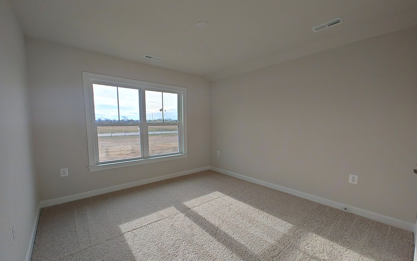 The secondary bedroom of the Hemingway garden home on homesite 2121.