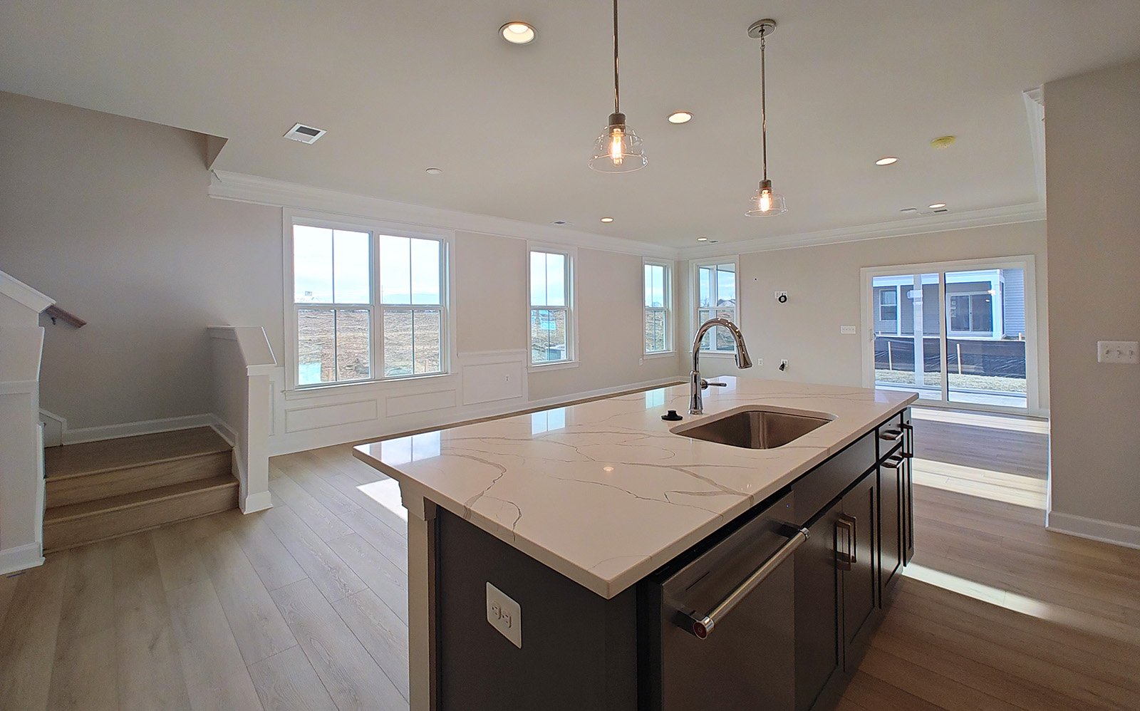 The kitchen and dining room of the Hemingway garden home on homesite 2121.
