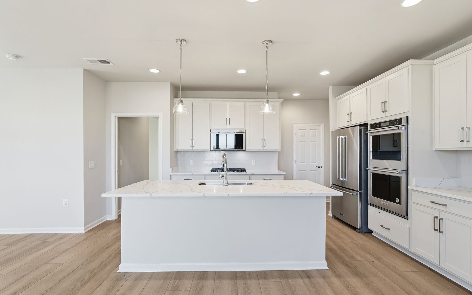 The kitchen of the Hemingway on homesite 2111 at Hiatt Pointe at Snowden Bridge.