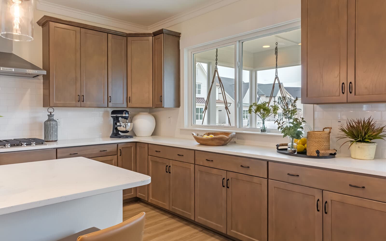 The kitchen with sliding door to the screened porch of the Denison by Brookfield Residential