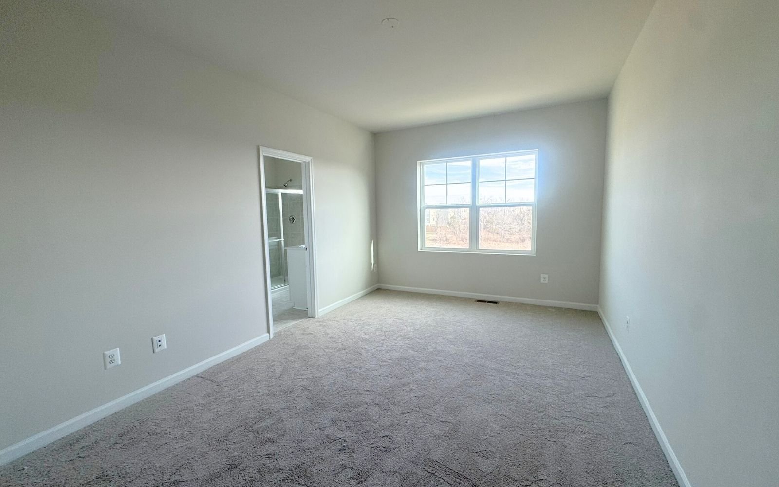 The primary bedroom of the Skyline on homesite 2153 at Snowden Bridge.
