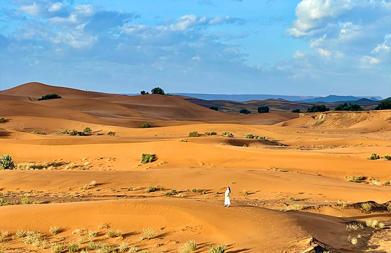Erica Bray standing in the Sahara in Morocco