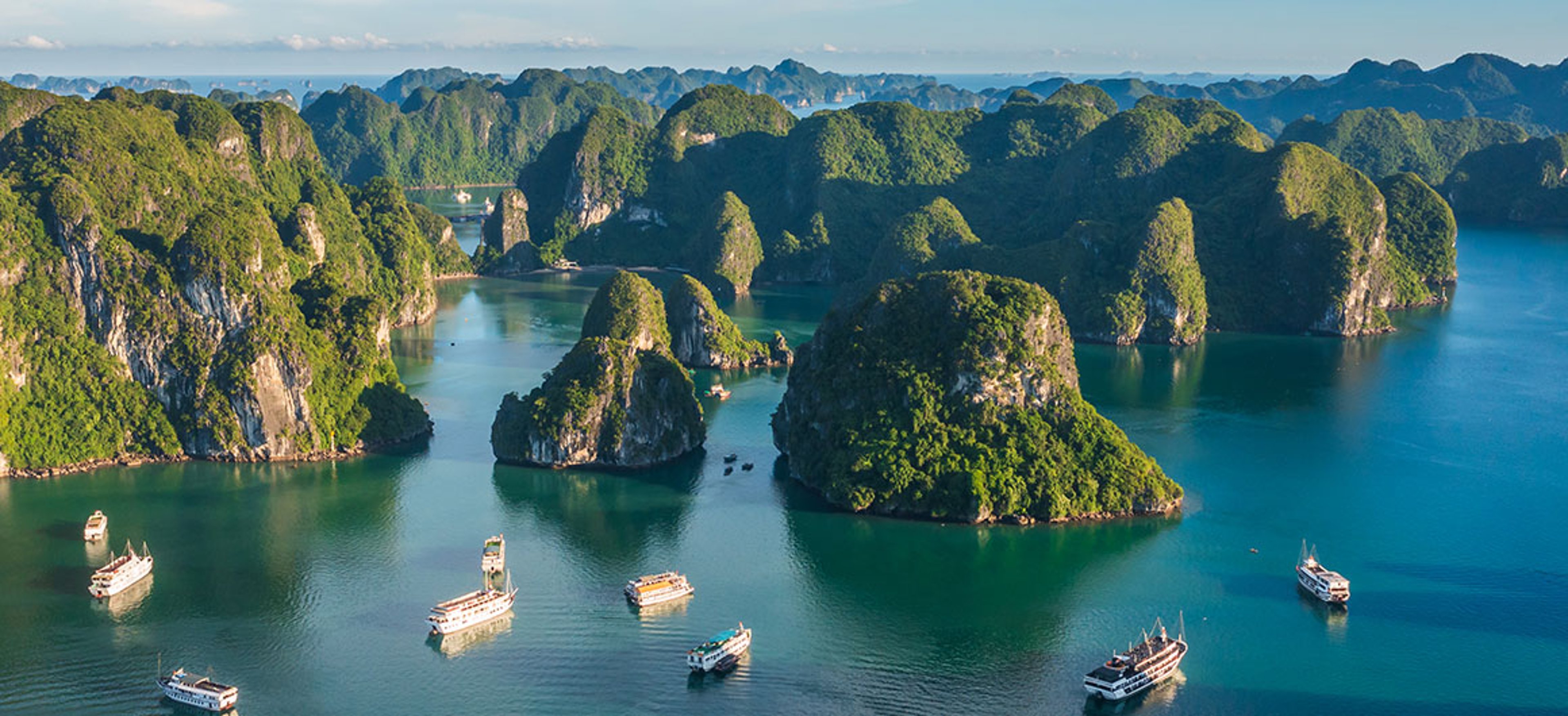 Aerial view of Ha Long Bay in beautiful day, clear blue sky; Credit: Satori Photography