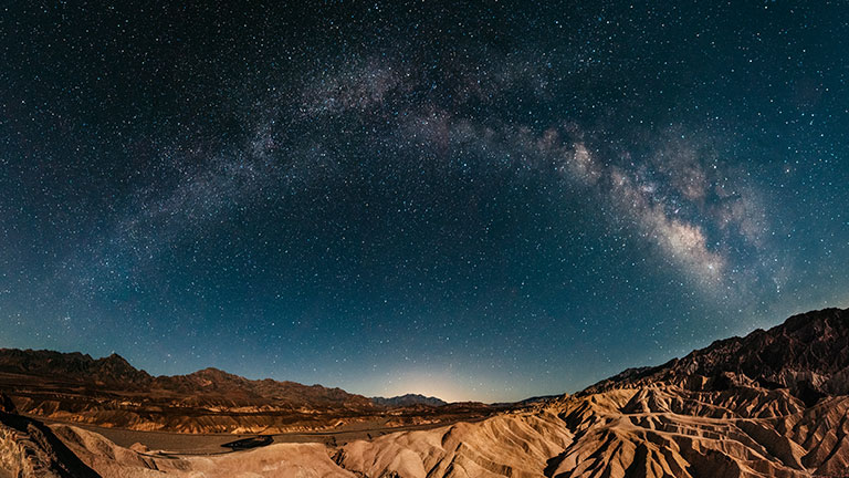 Milky way raising over Zabriskie Point in Death Valley; Credit: ferrantraite