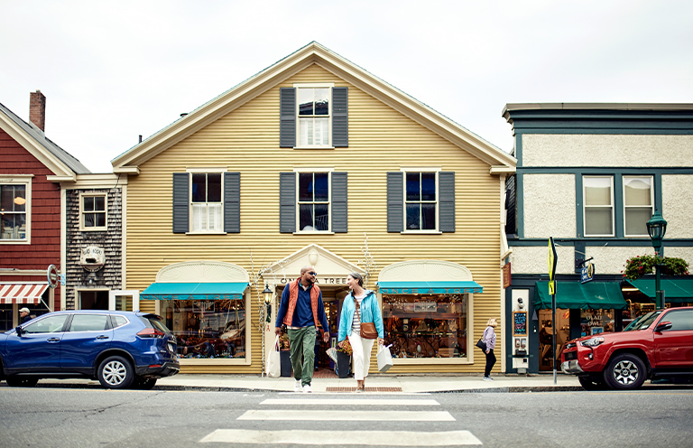 Man and woman on balcony of Camden Harbor Inn