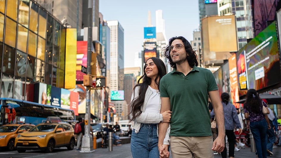 man and woman in time square nyc