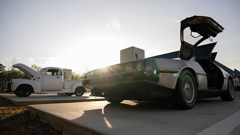 electric converted DMC 12 DeLorean and electric replica of a classic 1952 pick-up truck