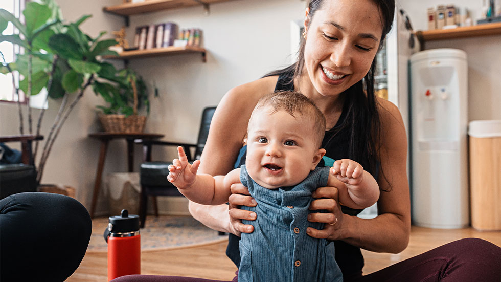 Erica and her seven-month-old son play in the lobby of & Yoga