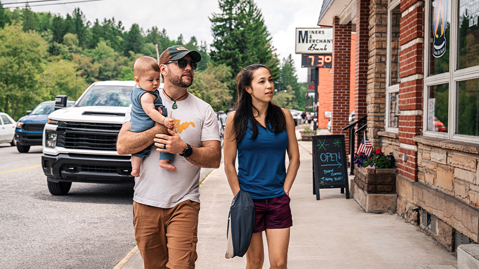 Erica, her husband and son stroll down Front Street in Thomas, West Virginia