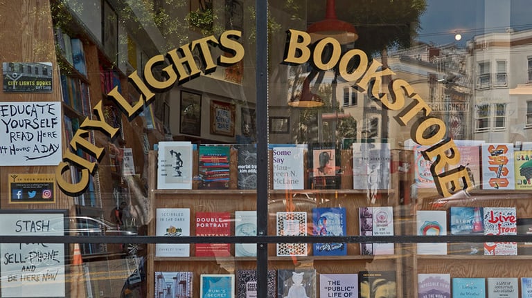 San Francisco, CA / USA - August 2017: City Lights Bookstore showcase at Columbus Ave. Credit: Manel Vinuesa/iStock.com