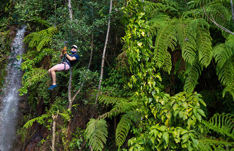 man zip lining in Costa Rica