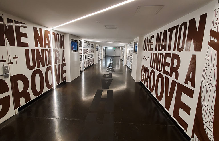 The hallway with message 'One Nation Under A Groove' inside of National Museum of African American Music